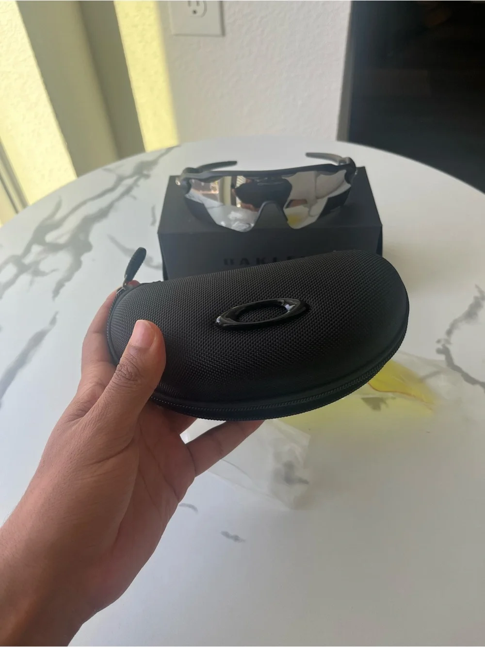 Oakley Black Frame Sunglasses with Silver Mirror Lens